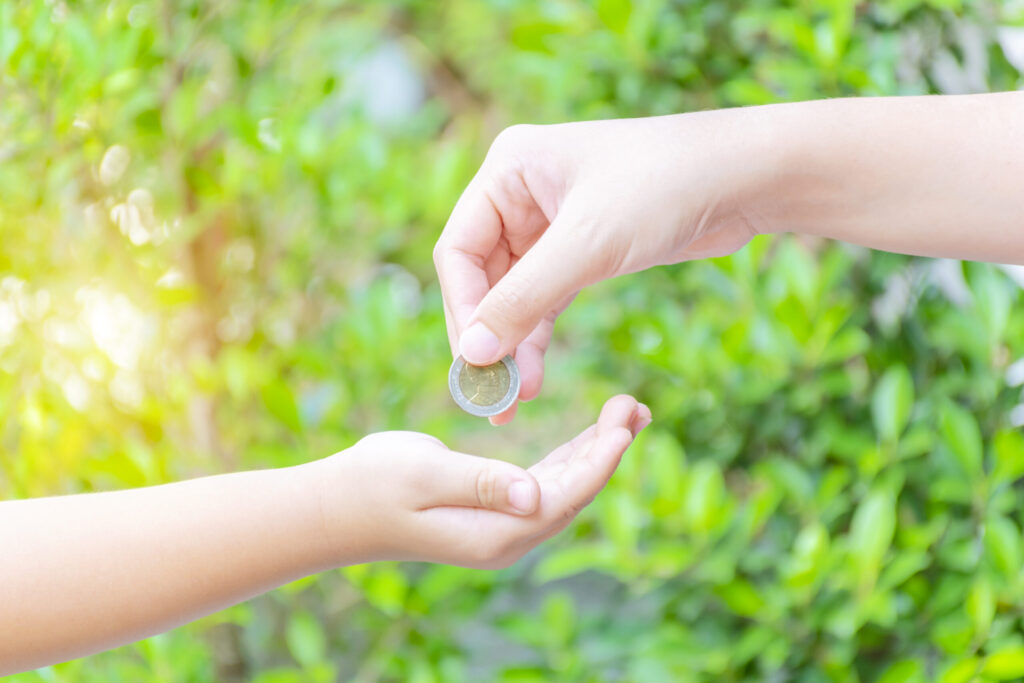 Donate mother giving coin